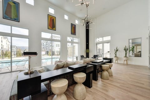 Inside Seating with Pool View , Long Black Desk, Wood Seats, Window and Hardwood Inspired Floor